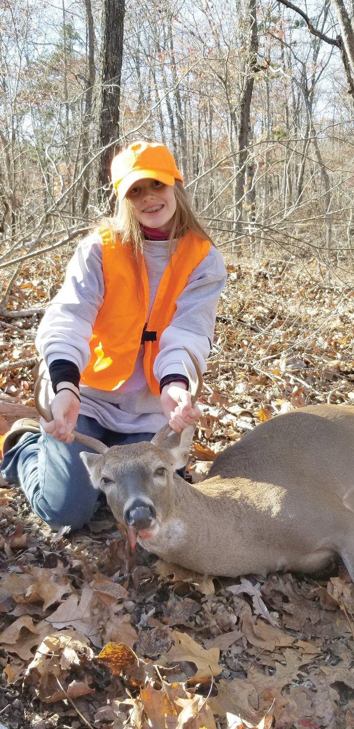 Timber Rice, 12, got this nice four-point buck hunting with her sister, Lea.
